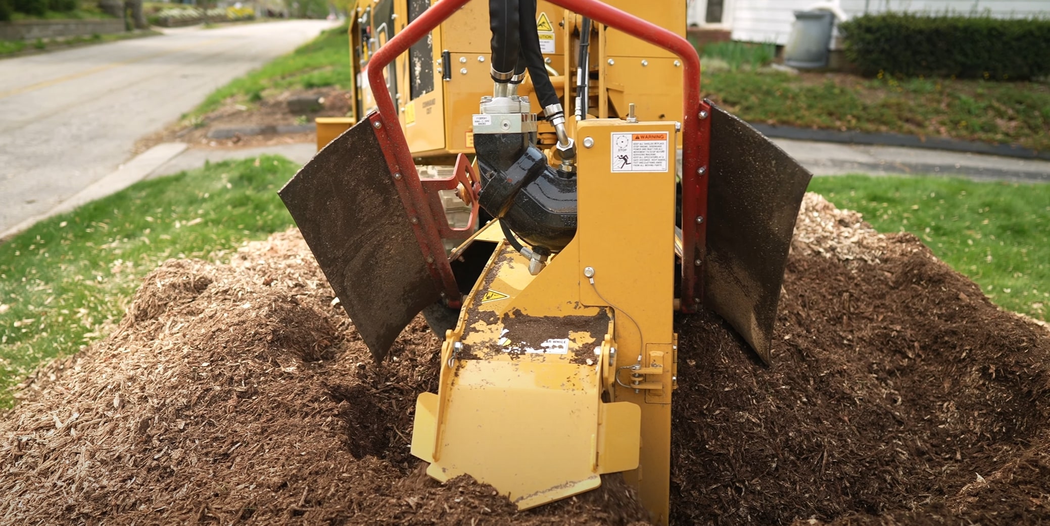 Stump grinding equipment working on a residential property in Tuscaloosa, AL
